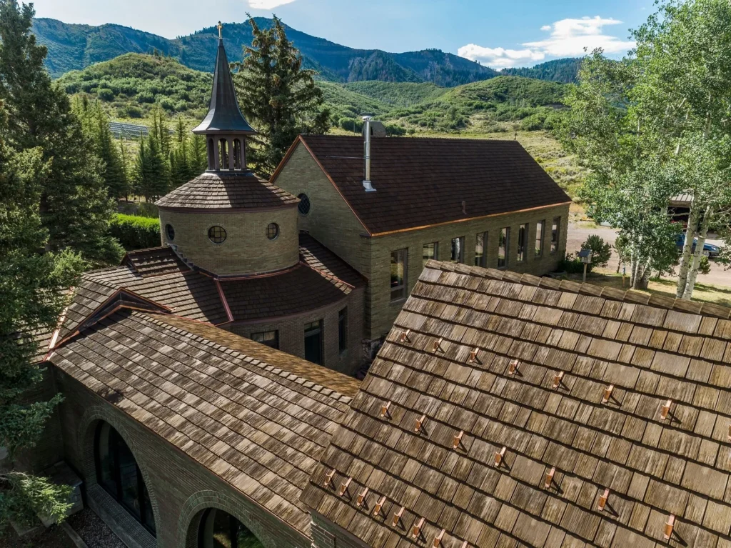 Monastery in the Colorado mountains with a Live Oak shake roof.