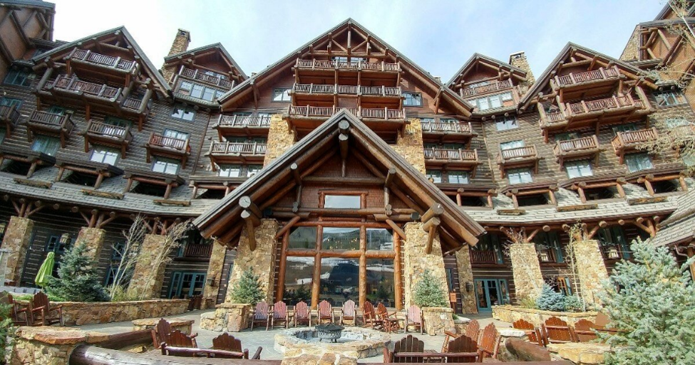 Luxury mountain lodge featuring a CeDUR synthetic shingle roof with timber and stone architecture.