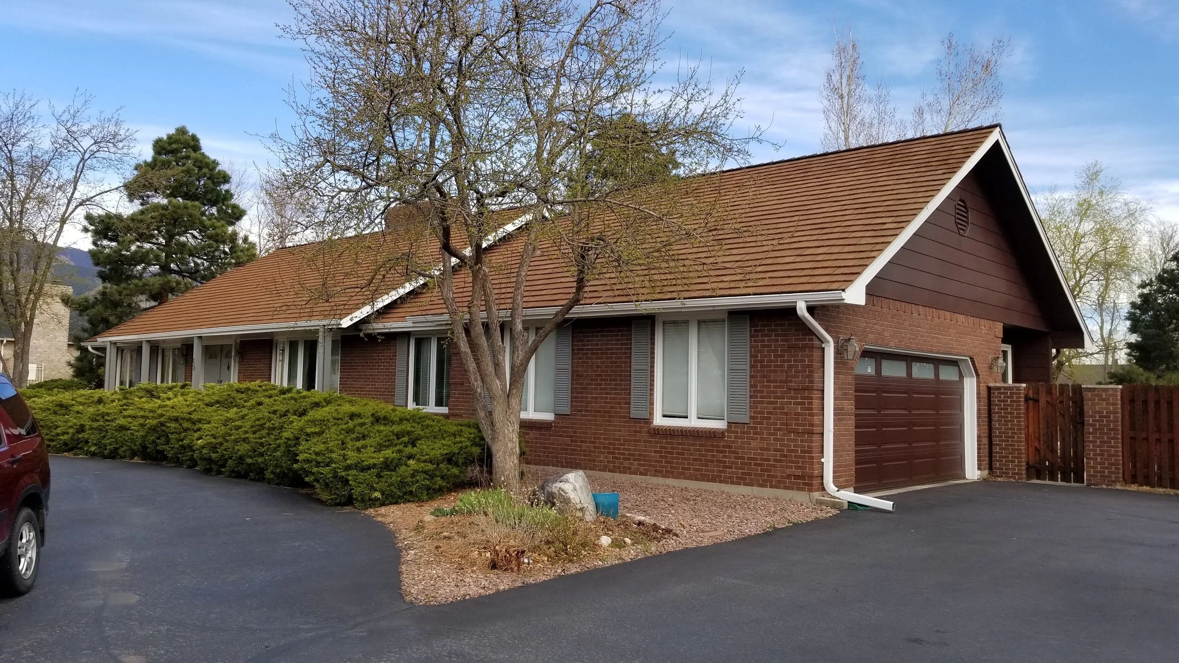 Brick siding with golden cedar roof