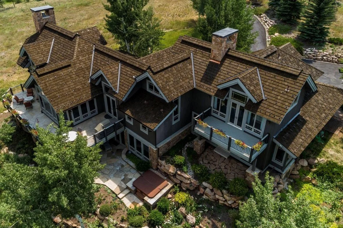 An image of a two-story house in Colorado with a CEDUR Walden roof.