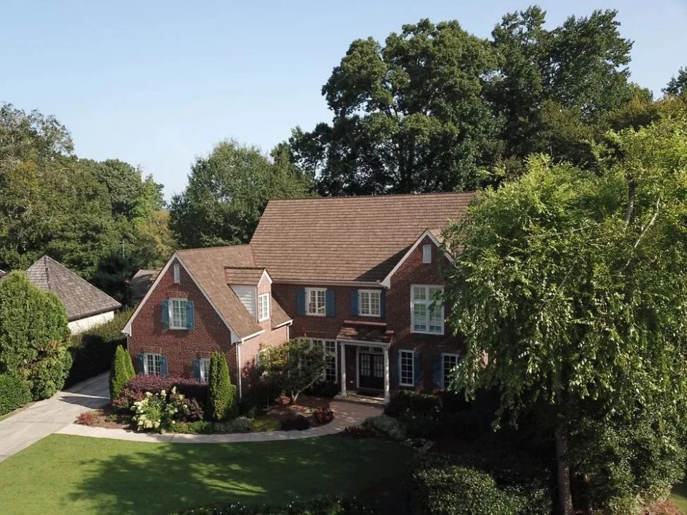Brown synthetic shake roof on a classic Southern home