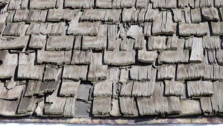 cedar-shake-shingles-worn-out-missing-shingles-on-roof.jpg