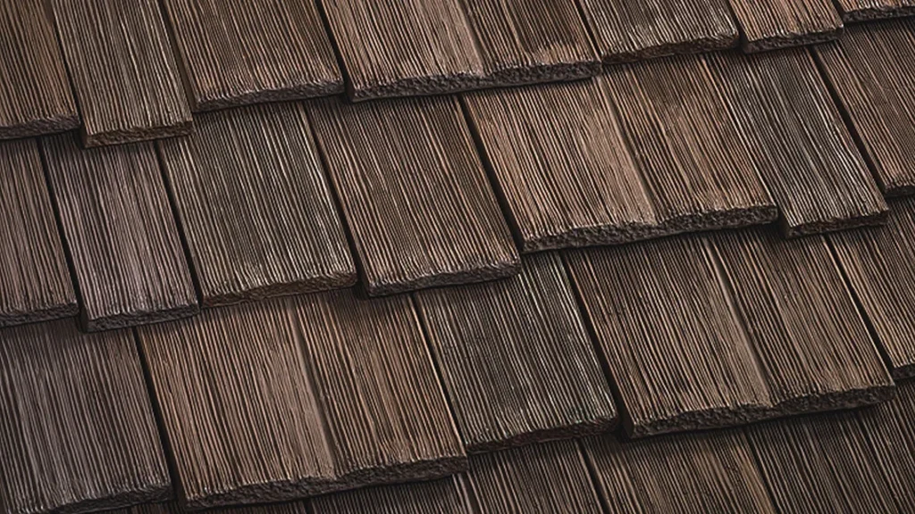 Synthetic polymer hail resistant roofing shingles