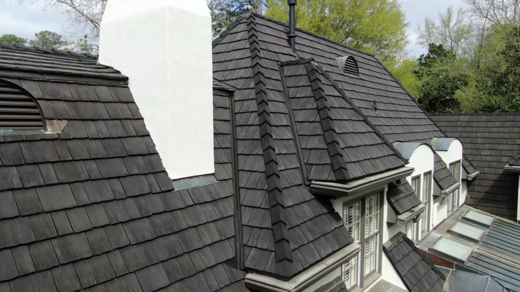 A gray synthetic roof on a residental house.