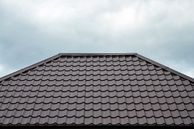 Metal roof shingles that look like Spanish clay tiles.