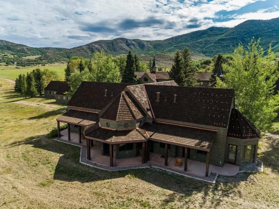 Brown CEDUR Walden roof in Snowmass, Colorado, with timber framing and snowy landscape, installed by Horn Brothers Roofing