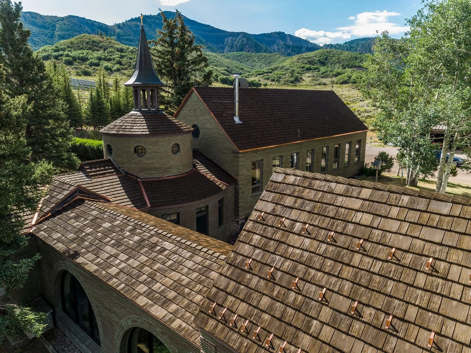 Historical Monastery roof with composite synthetic CEDUR roofing shingles.