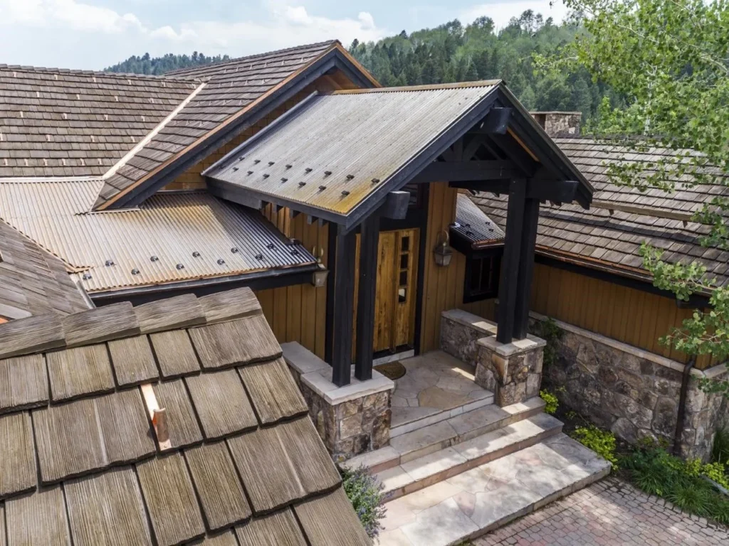 Combination metal and shake roofing features on a home.